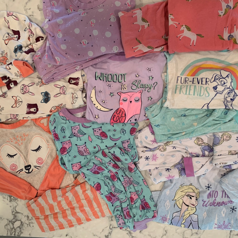 8 pairs of 4T little girl pajamas.